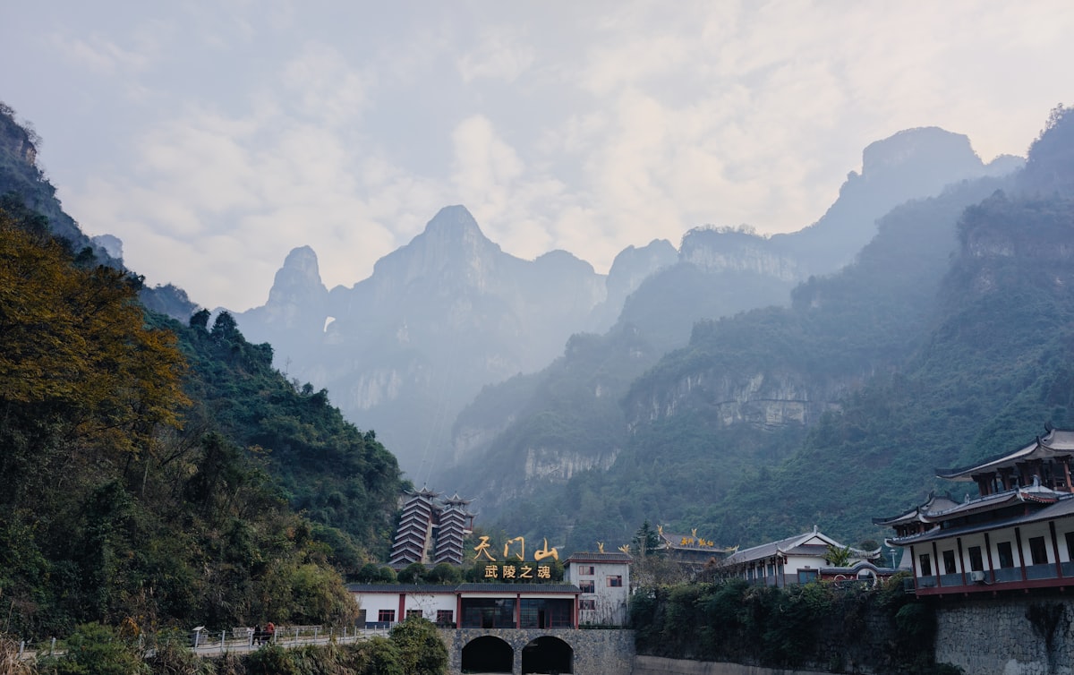 Cyclist riding through misty mountain roads in China — dedicated greenways and epic high-altitude routes make 2026 the best year yet for bike touring